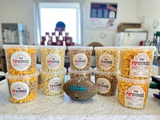 Plastic tubs filled with gourmet popcorn